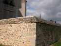 Mur en moellons avec enduit à la chaux " beurré"